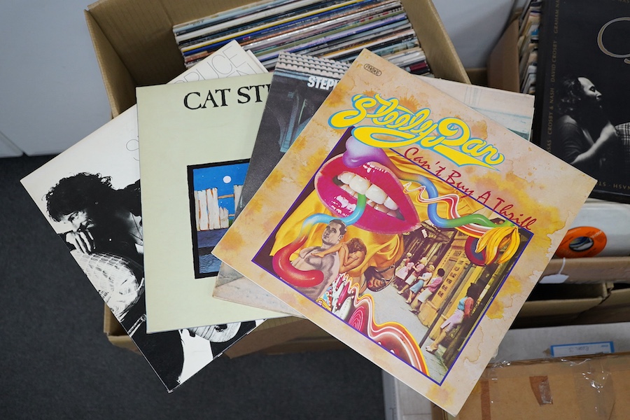 Approximately sixty LP record albums, artists include; Cat Stevens, Bruce Springsteen, Stephen Stills, Steely Dan, America, Eric Clapton, The Cars, Michael Jackson, Daryl Hall, Genesis, Marvin Gaye, etc. Condition - fair